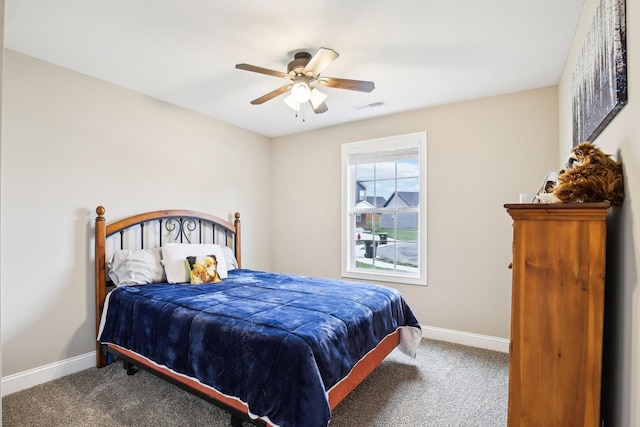 bedroom featuring ceiling fan and carpet