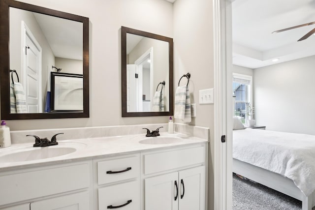 bathroom featuring ceiling fan and vanity