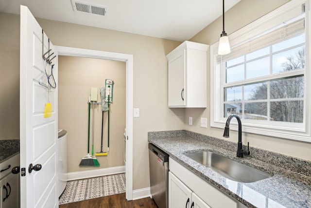 kitchen with sink, light stone counters, stainless steel dishwasher, dark hardwood / wood-style floors, and white cabinets