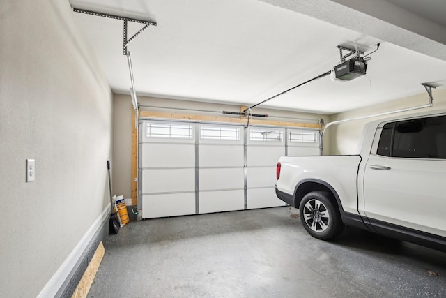 garage featuring a garage door opener