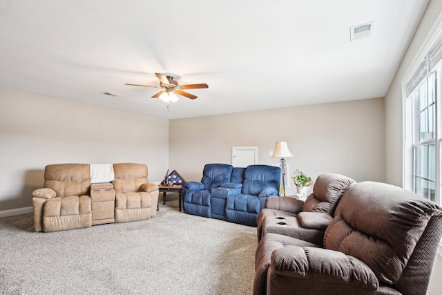 living room with carpet flooring and ceiling fan