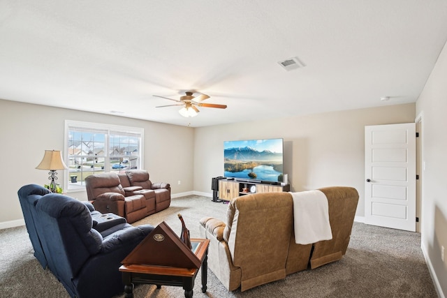 carpeted living room featuring ceiling fan