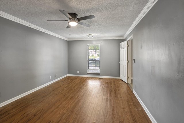 spare room featuring hardwood / wood-style floors, ceiling fan, ornamental molding, and a textured ceiling