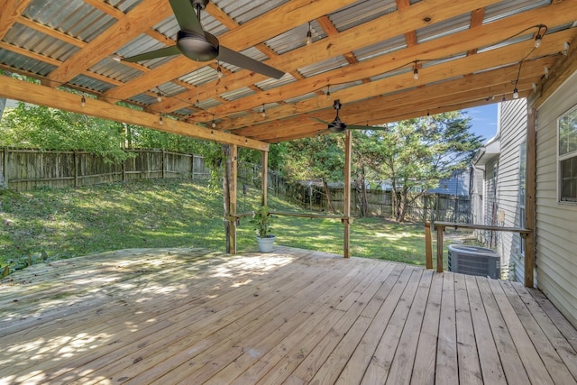 wooden deck featuring ceiling fan, a yard, and central AC unit