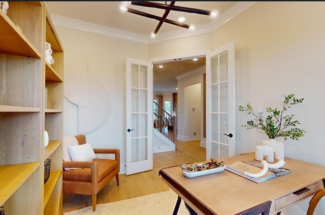 office space with ornamental molding, light hardwood / wood-style flooring, and french doors