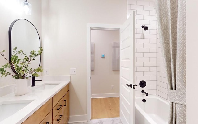 bathroom featuring vanity and shower / bath combination with curtain