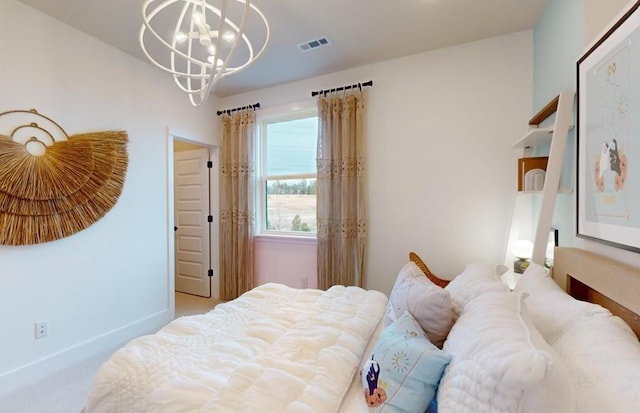 bedroom with light carpet and a notable chandelier