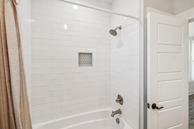 bathroom featuring shower / bath combination with curtain