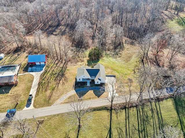 aerial view featuring a wooded view