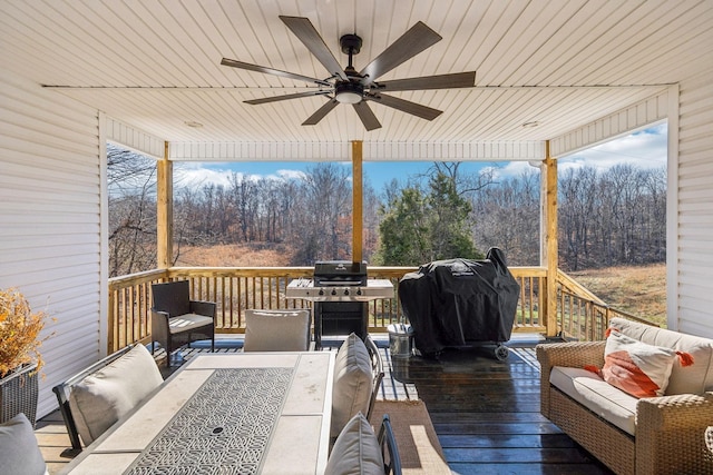 deck featuring area for grilling, an outdoor living space, and ceiling fan