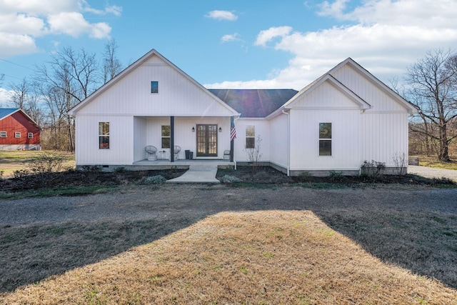 modern inspired farmhouse featuring crawl space, a porch, and french doors