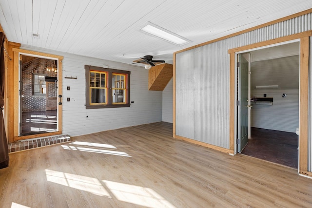 interior space with ceiling fan and light hardwood / wood-style flooring