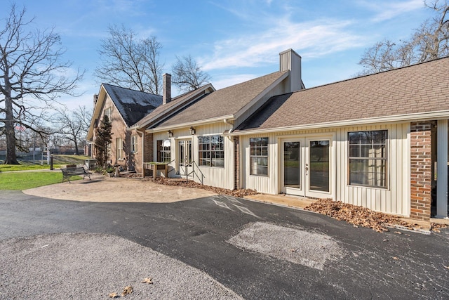 back of house featuring french doors