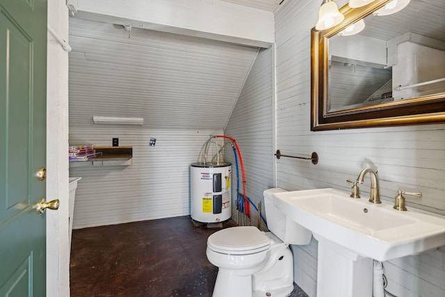 bathroom featuring lofted ceiling, electric water heater, sink, toilet, and concrete floors