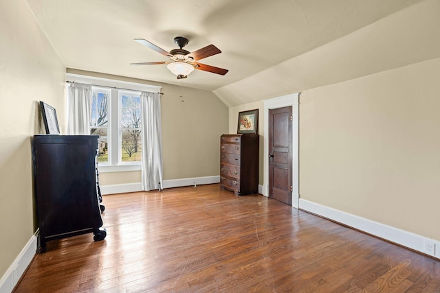 interior space featuring hardwood / wood-style floors, ceiling fan, and lofted ceiling