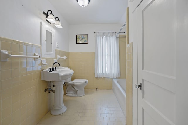 bathroom with  shower combination, toilet, and tile walls