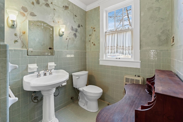 bathroom with ornamental molding, sink, tile walls, tile patterned flooring, and toilet