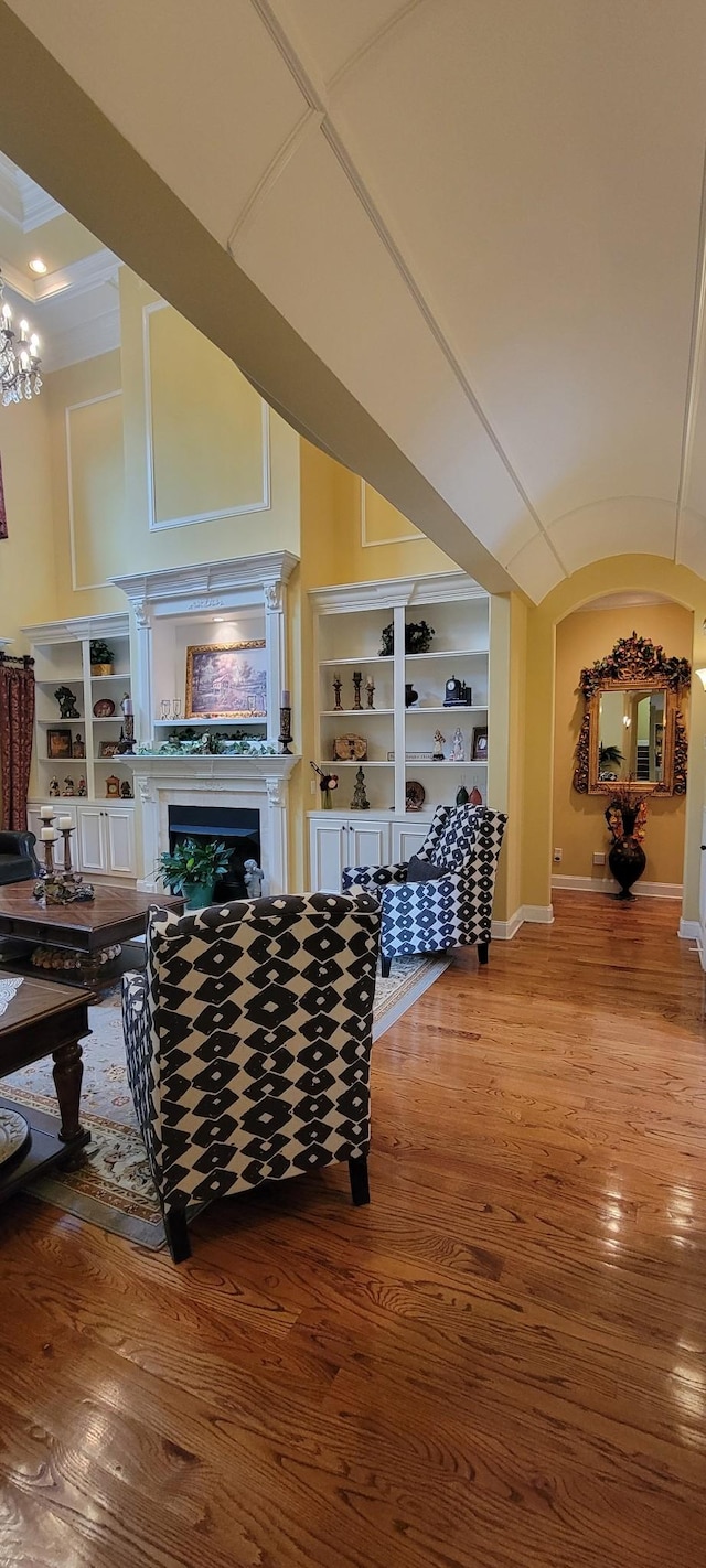 living room with a chandelier and hardwood / wood-style flooring