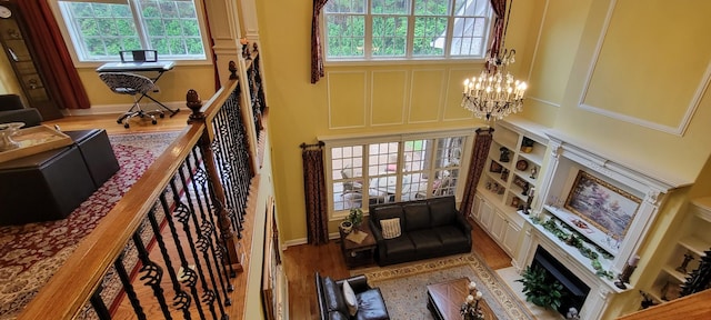 living room with a notable chandelier and light hardwood / wood-style flooring