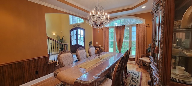 dining area with ornamental molding, french doors, and wood-type flooring