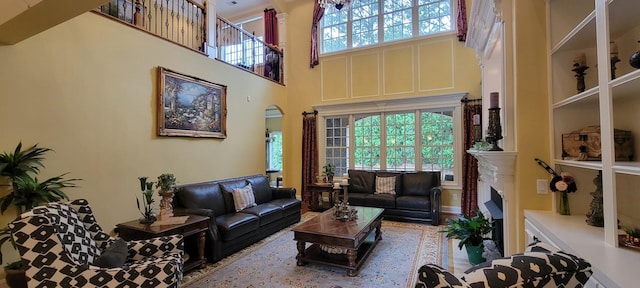 living room with a towering ceiling