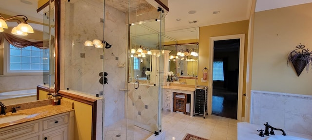 bathroom featuring an inviting chandelier, separate shower and tub, and vanity