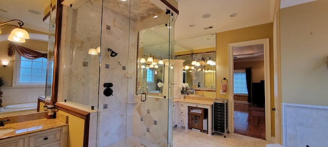 bathroom featuring ornamental molding, plus walk in shower, and vanity