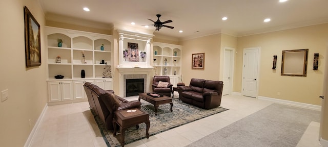 tiled living room with ornamental molding, ceiling fan, and built in features