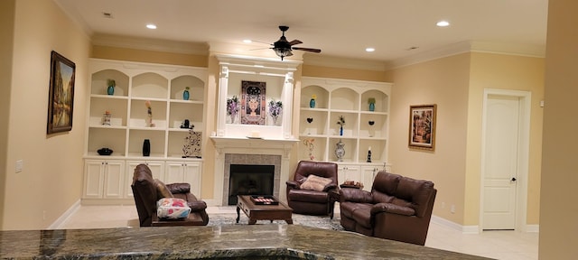 living room with ceiling fan, light tile patterned floors, ornamental molding, and built in features