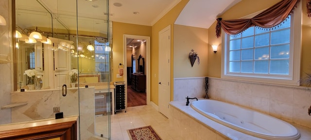 bathroom featuring tile patterned flooring, ornamental molding, independent shower and bath, and plenty of natural light