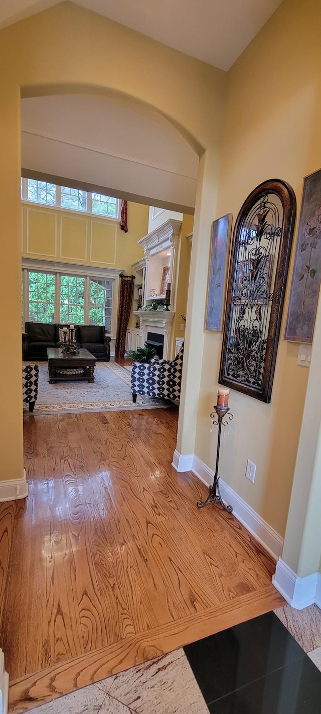 corridor with hardwood / wood-style floors