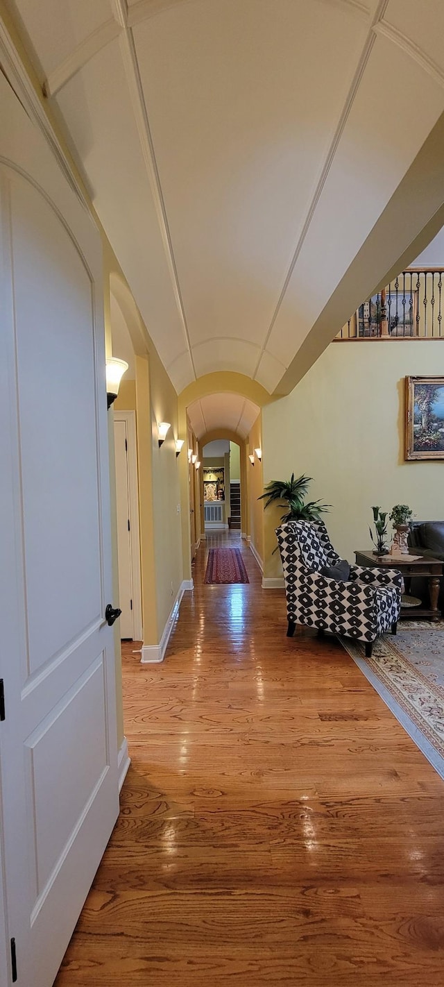 hall with hardwood / wood-style floors