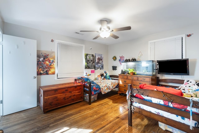 bedroom featuring dark hardwood / wood-style flooring and ceiling fan