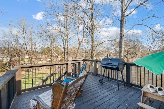 wooden terrace with a grill