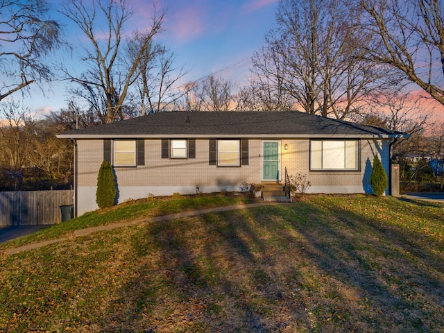 ranch-style house with a yard