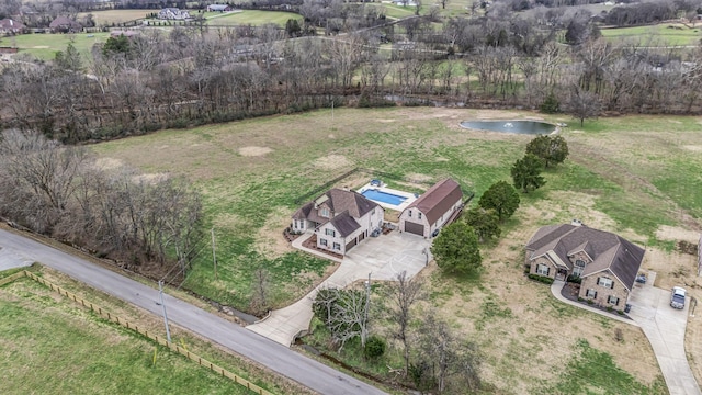 birds eye view of property with a rural view