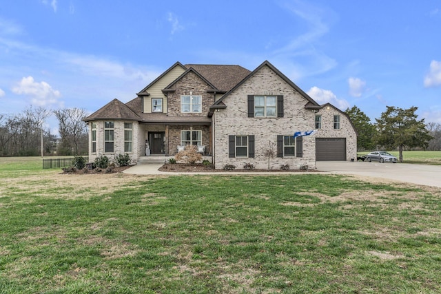 craftsman-style house with a front yard and a garage