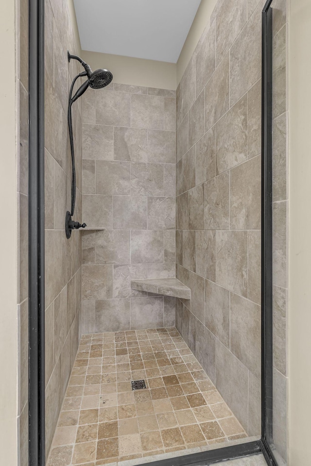 bathroom featuring tiled shower