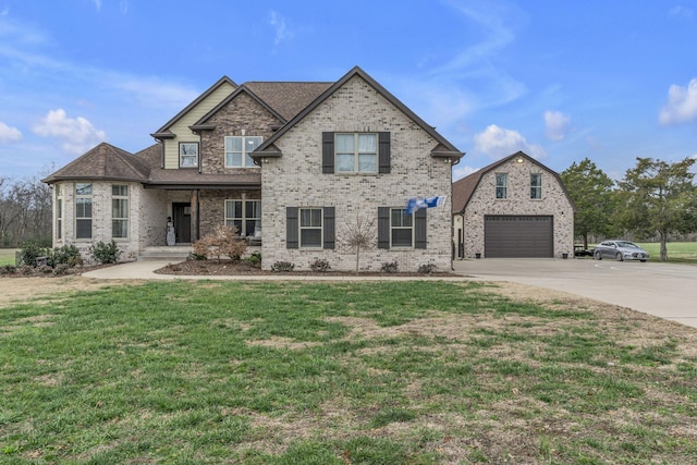 view of front of home featuring a garage and a front lawn