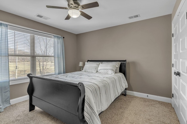 carpeted bedroom featuring ceiling fan