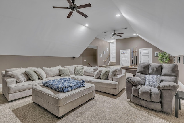 living room featuring ceiling fan, light colored carpet, and vaulted ceiling