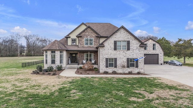 craftsman house with a porch, a garage, and a front lawn