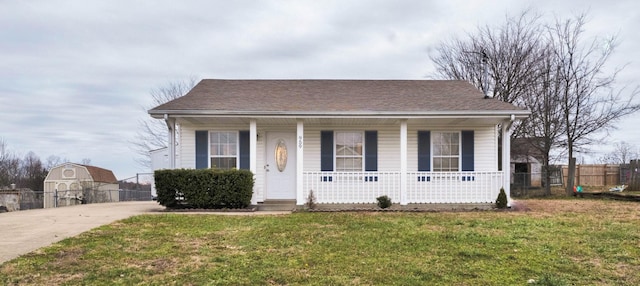 bungalow-style house with covered porch and a front lawn