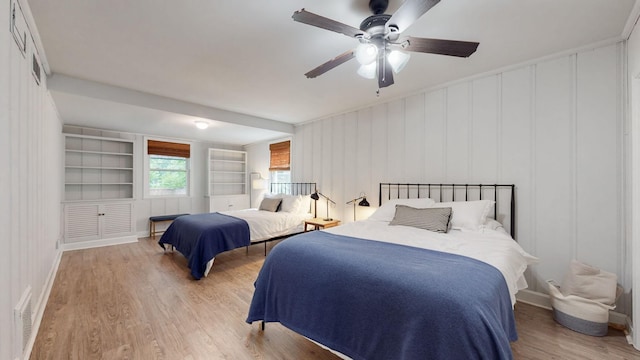 bedroom with ceiling fan and light hardwood / wood-style floors