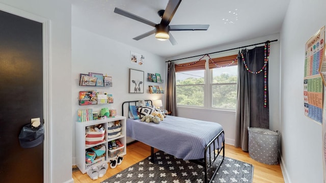 bedroom featuring light hardwood / wood-style floors and ceiling fan