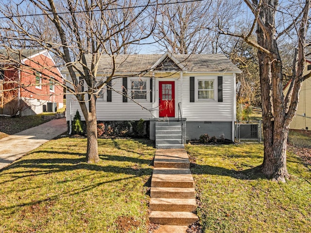 view of front of house featuring a front lawn and central AC unit