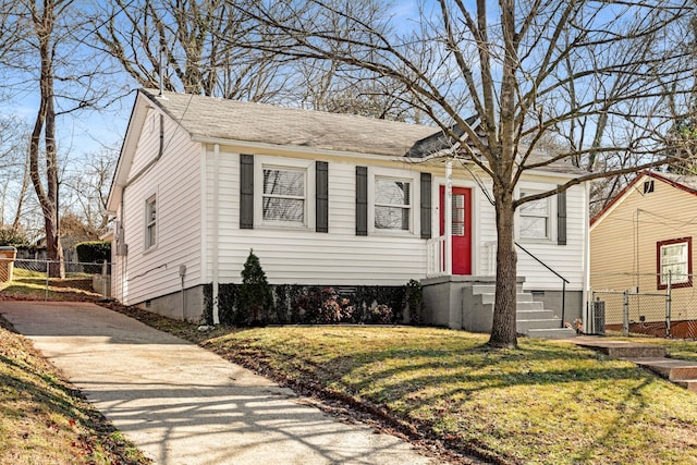 view of front facade featuring cooling unit and a front yard