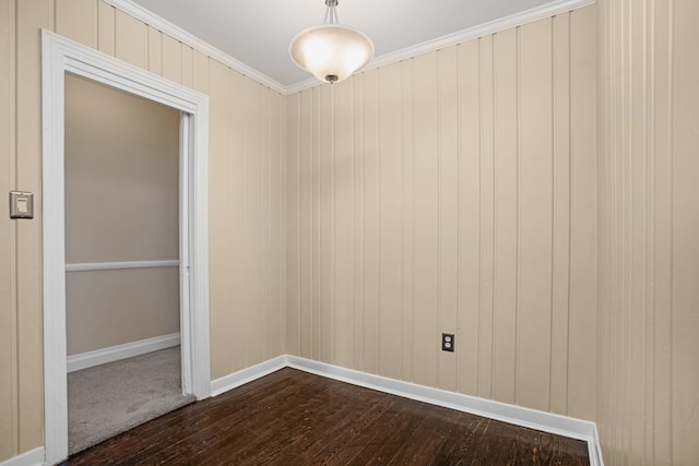 spare room with hardwood / wood-style flooring and ornamental molding