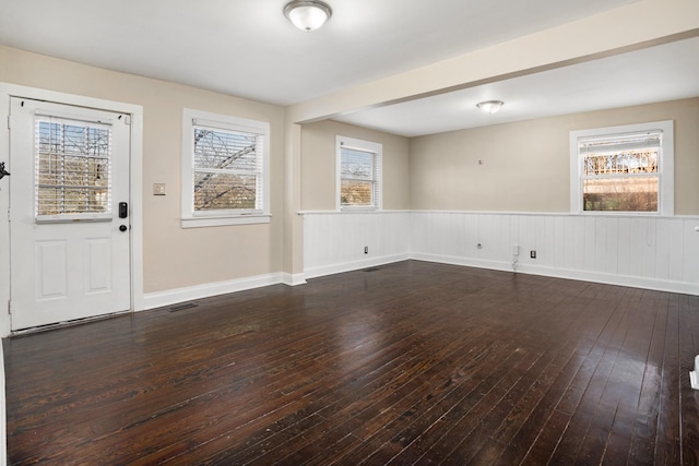 foyer entrance featuring dark hardwood / wood-style floors