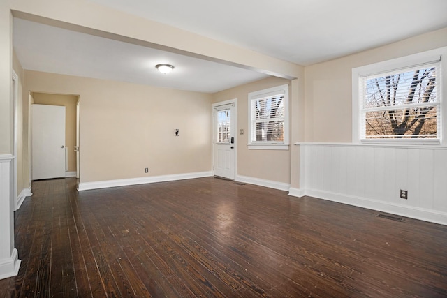 empty room featuring dark hardwood / wood-style floors